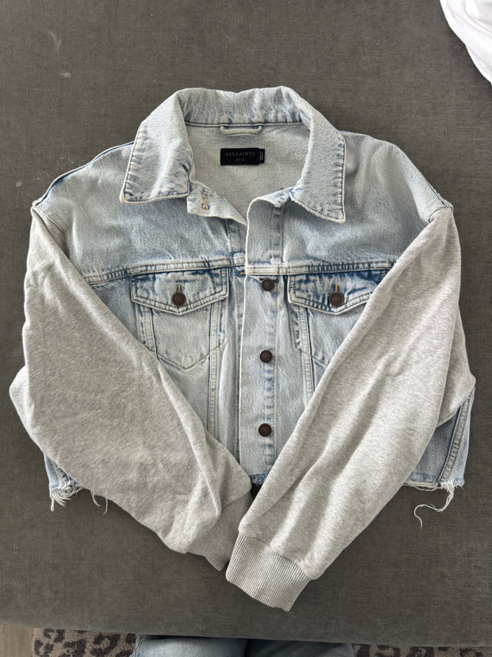 All Saints Light Wash Denim Jacket with Gray Knit Sleeves